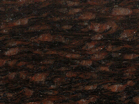 Cats Eye granite sample — Warm brown with bold, dark banding.