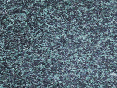 Evergreen granite sample — Dark green with contrasting mineral flecks.