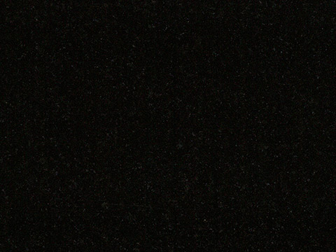 Black granite sample — Deep black with a fine, subtle grain.
